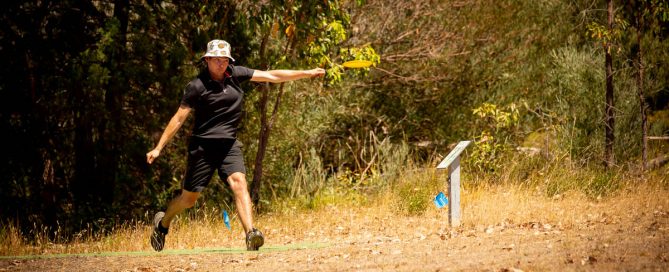 An image of woman playing disc golf